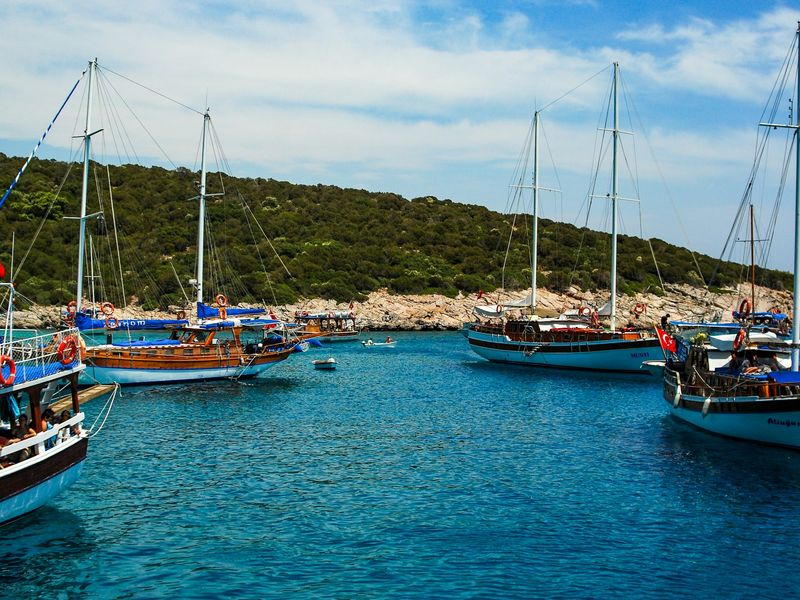 A clear blue sky in Bodrum adorned with fluffy white clouds, creating a serene and tranquil atmosphere.
